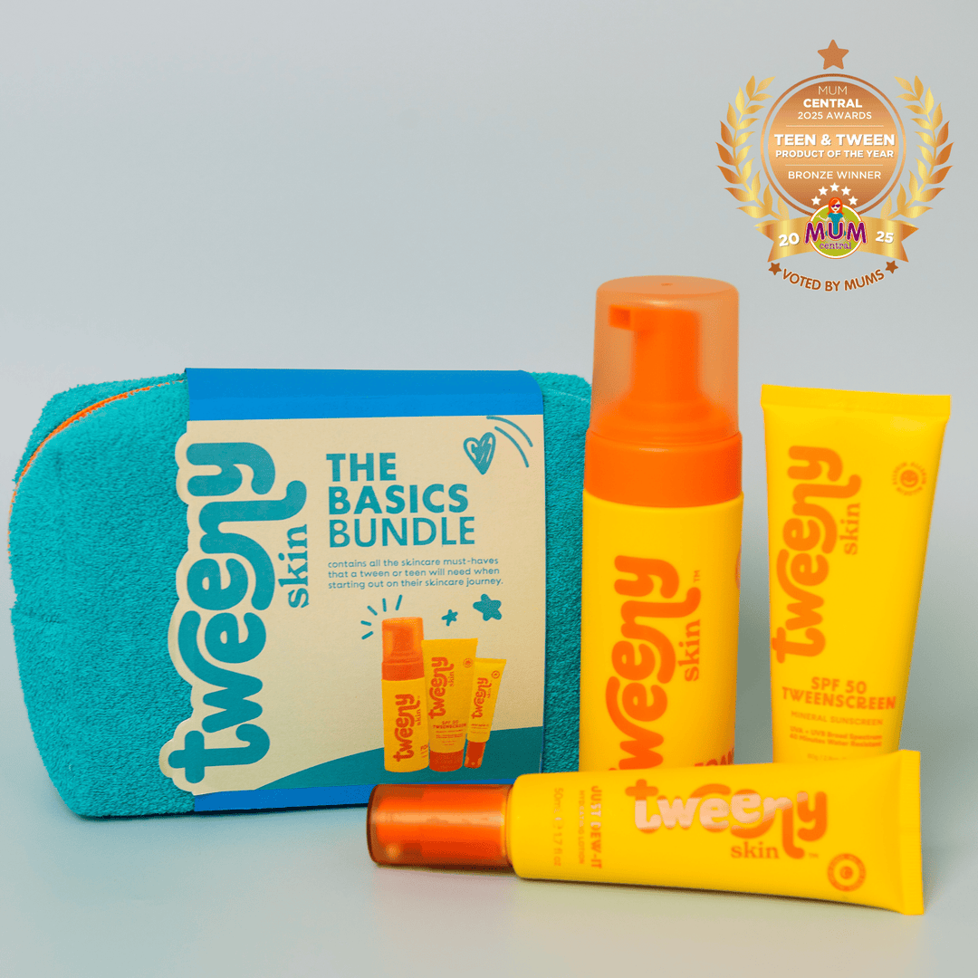 Tweeny Skin's award-winning "The Basics Bundle" skincare set for tweens and teens, featuring three bright yellow and orange skincare products (FOAM-O Gentle Cleanser, Just Dew-It hydrating lotion, and the award wining TweenScreen SPF 50 sunscreen) displayed with a vibrant blue towel bag. A Mum Central 2025 Teen & Tween Product of the Year bronze award badge is shown in the top right corner.