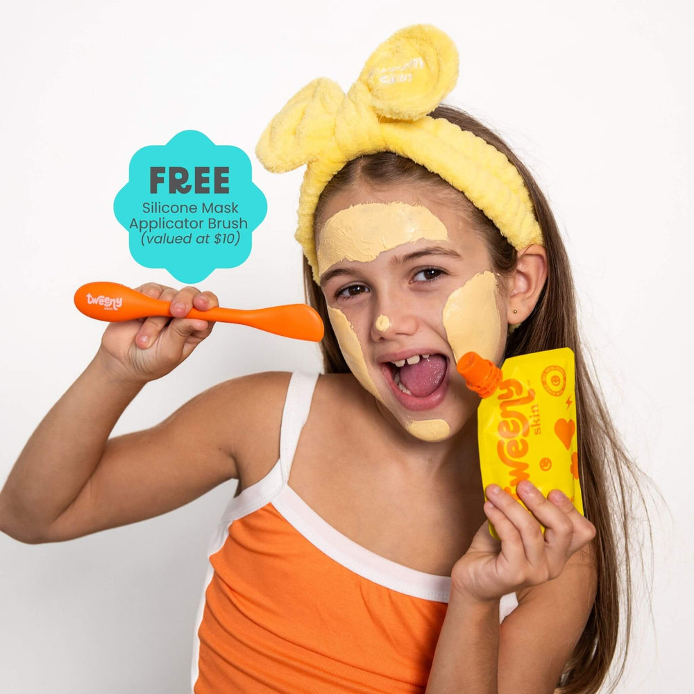 Tween applying Multi-Masker turmeric clay face mask with silicone applicator brush, fun skincare routine for tweens and teens