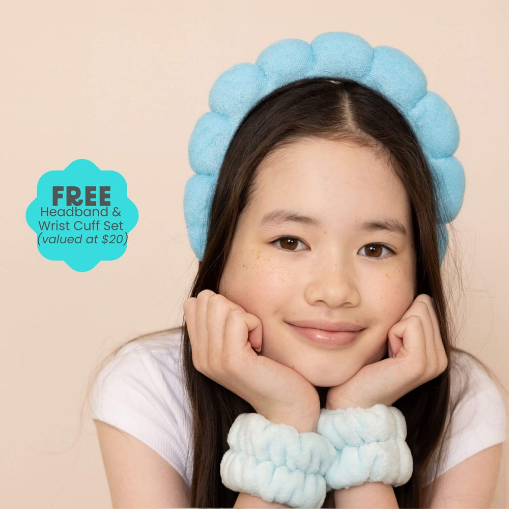 Tween girl wearing blue headband and wrist cuffs set for skincare routine, soft accessories for tweens and teens with gentle skincare