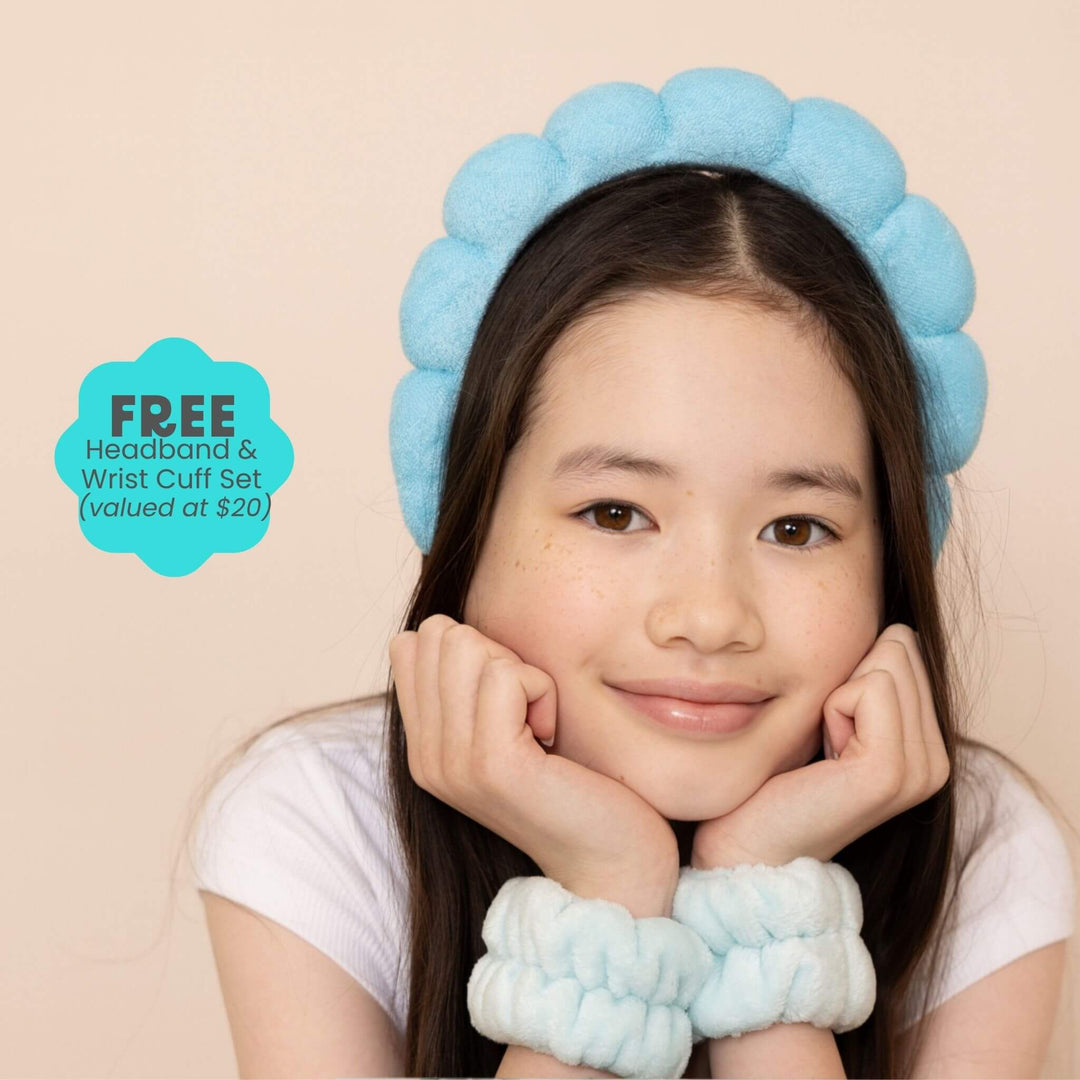 Tween girl wearing blue headband and wrist cuffs set for skincare routine, soft accessories for tweens and teens with gentle skincare
