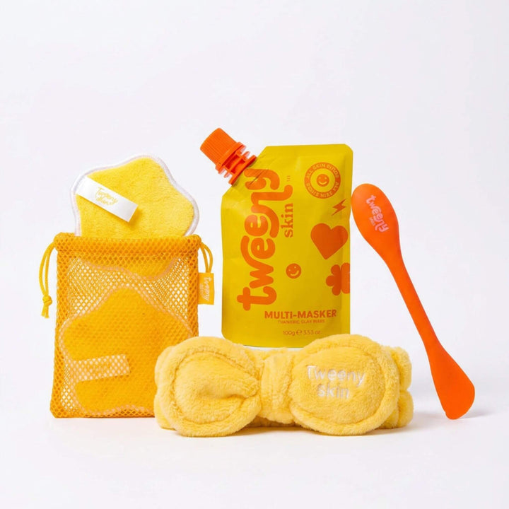 Tweeny Skin face mask bundle featuring Multi-Masker turmeric clay mask with applicator brush headband remover pads and wash bag for tween and teen skincare routine